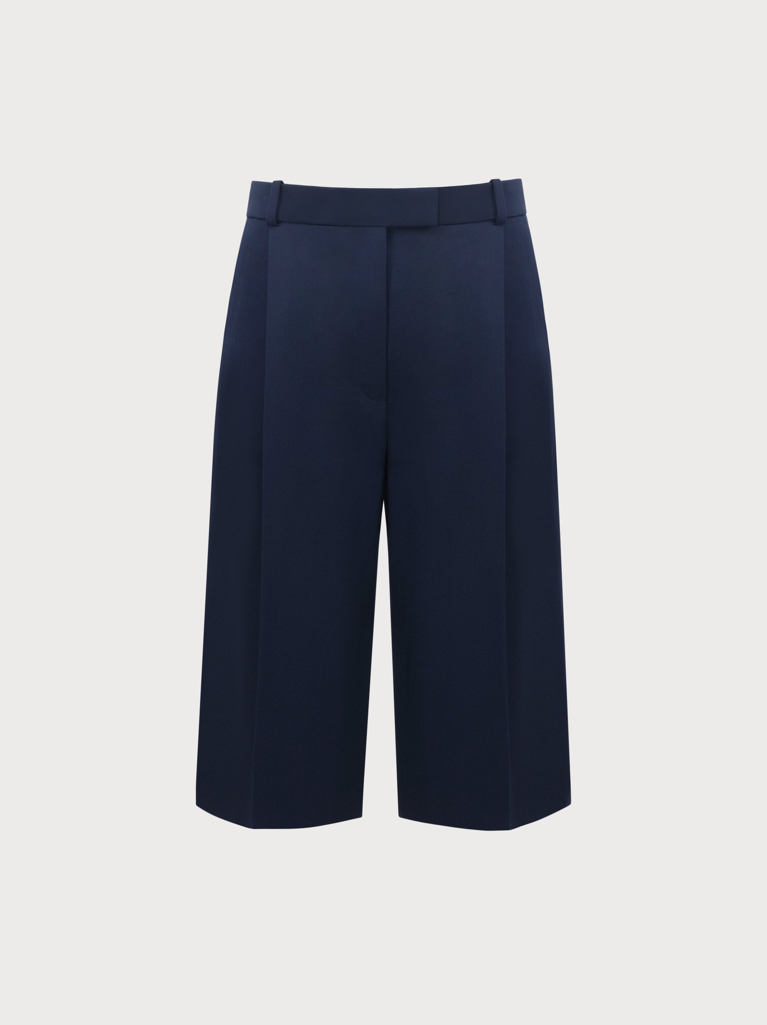 Navy blue wide-leg pants on a light gray background
