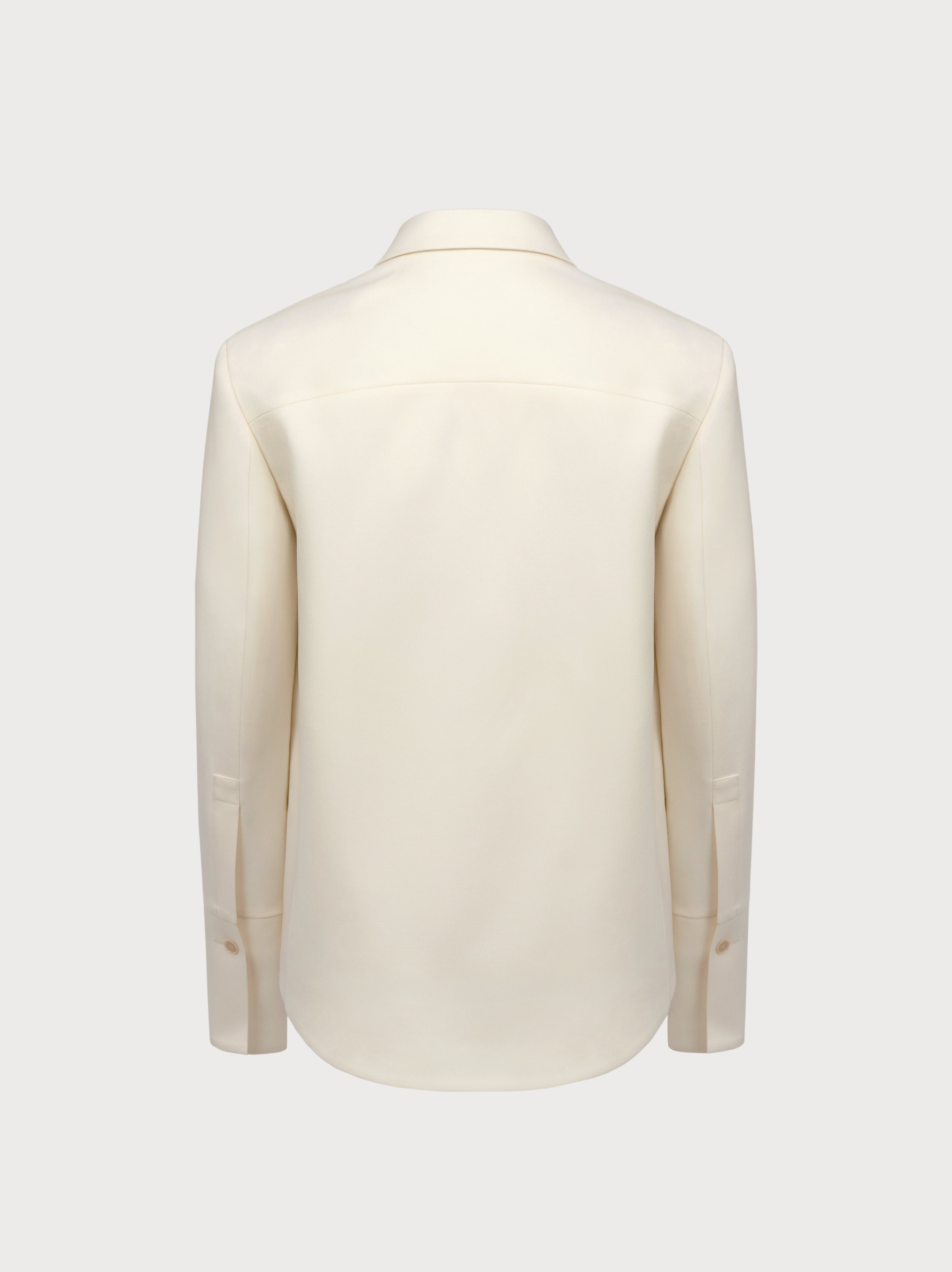 White suit jacket on a light gray background