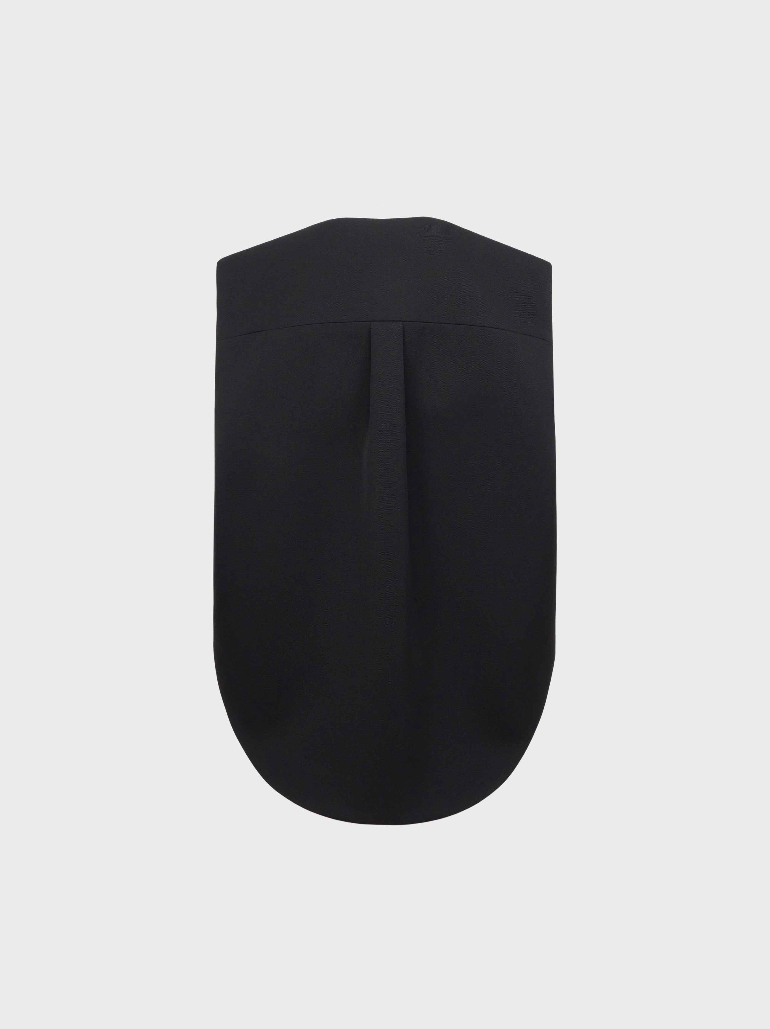 Black sleeveless top on a light gray background