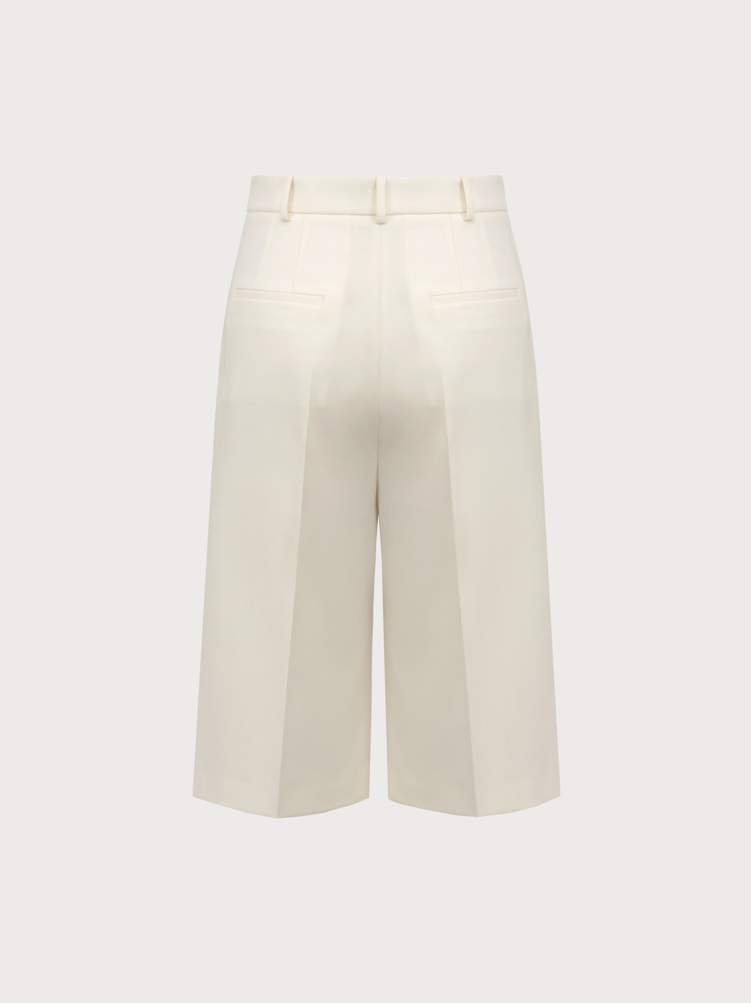 White wide-leg pants on a light gray background