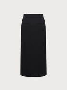 Black pencil skirt on a light gray background