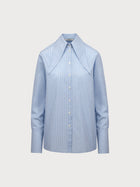 Light blue shirt on a light gray background