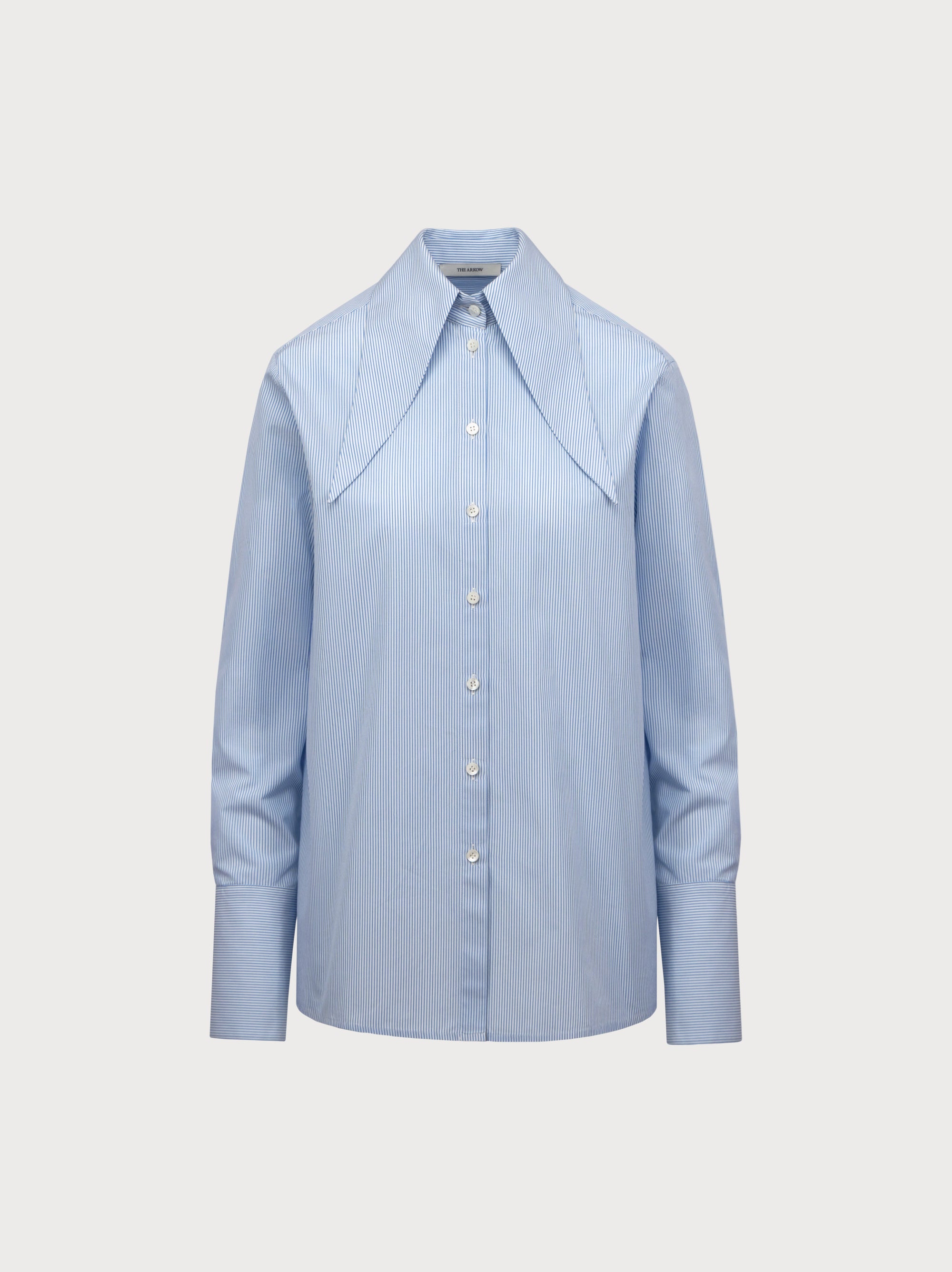 Light blue shirt on a light gray background