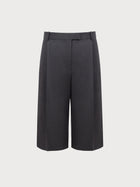 Grey high-waisted pants on a light gray background