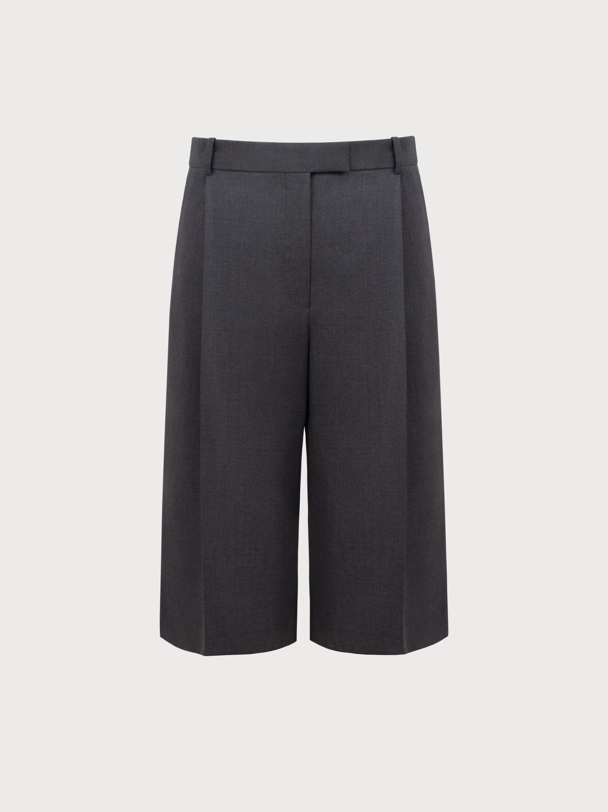 Grey high-waisted pants on a light gray background