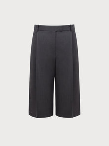 Grey high-waisted pants on a light gray background