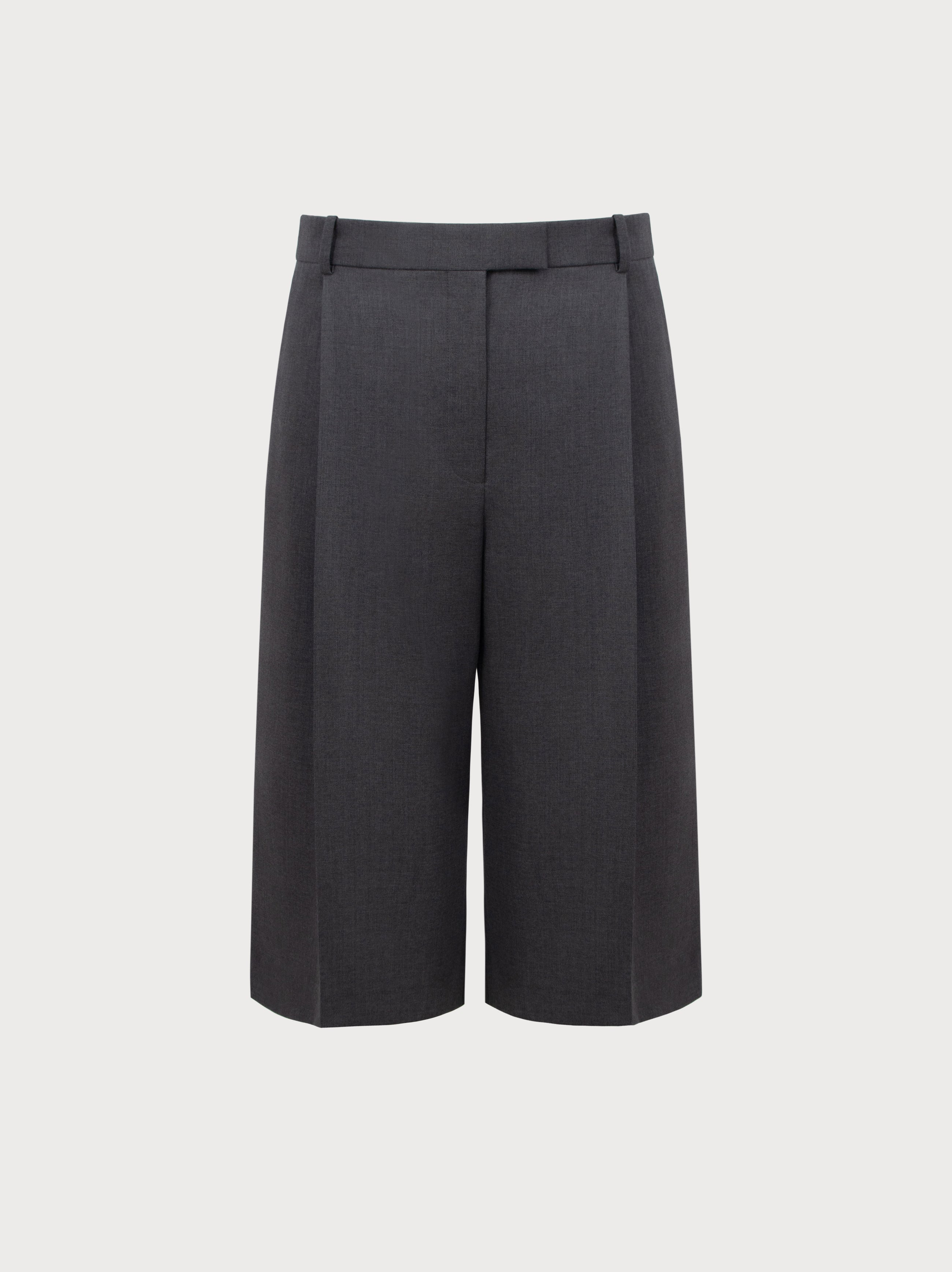 Grey high-waisted pants on a light gray background