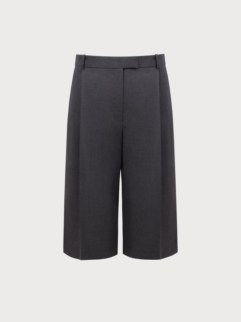 Grey high-waisted pants on a light gray background