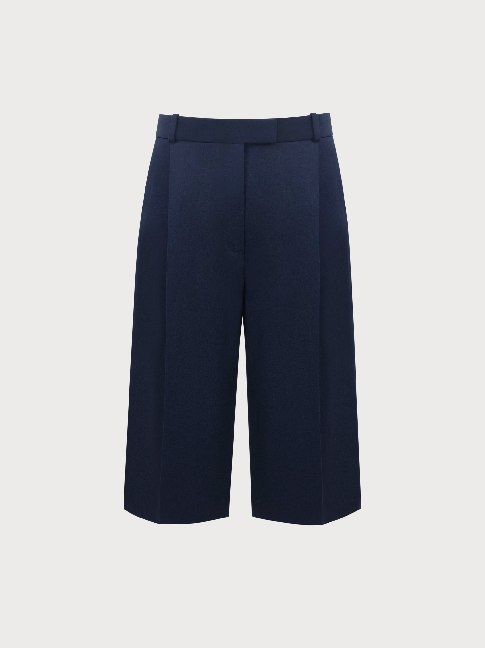 Navy blue wide-leg pants on a light gray background