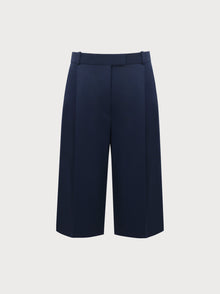 Navy blue wide-leg pants on a light gray background