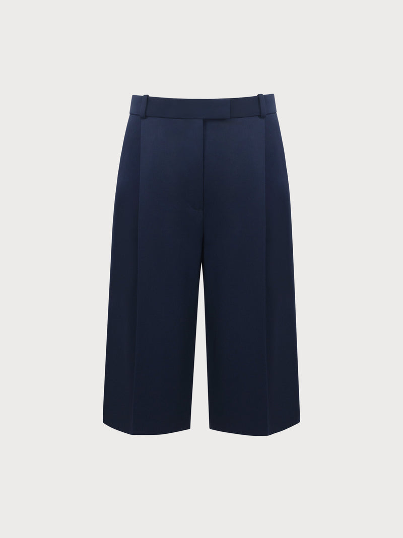 Navy blue wide-leg pants on a light gray background