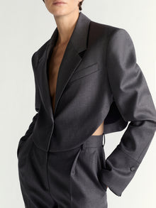 Gray blazer with cut-out design on a plain background