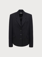 Black blazer on a light gray background