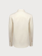 White suit jacket on a light gray background