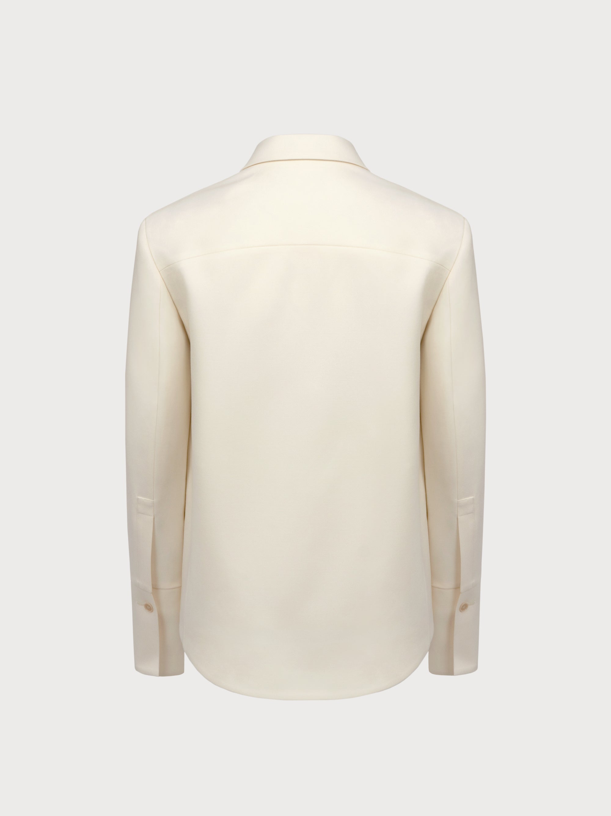 White suit jacket on a light gray background