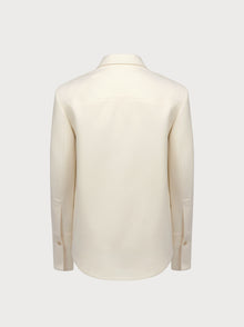 White suit jacket on a light gray background