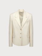 White blazer on a light gray background