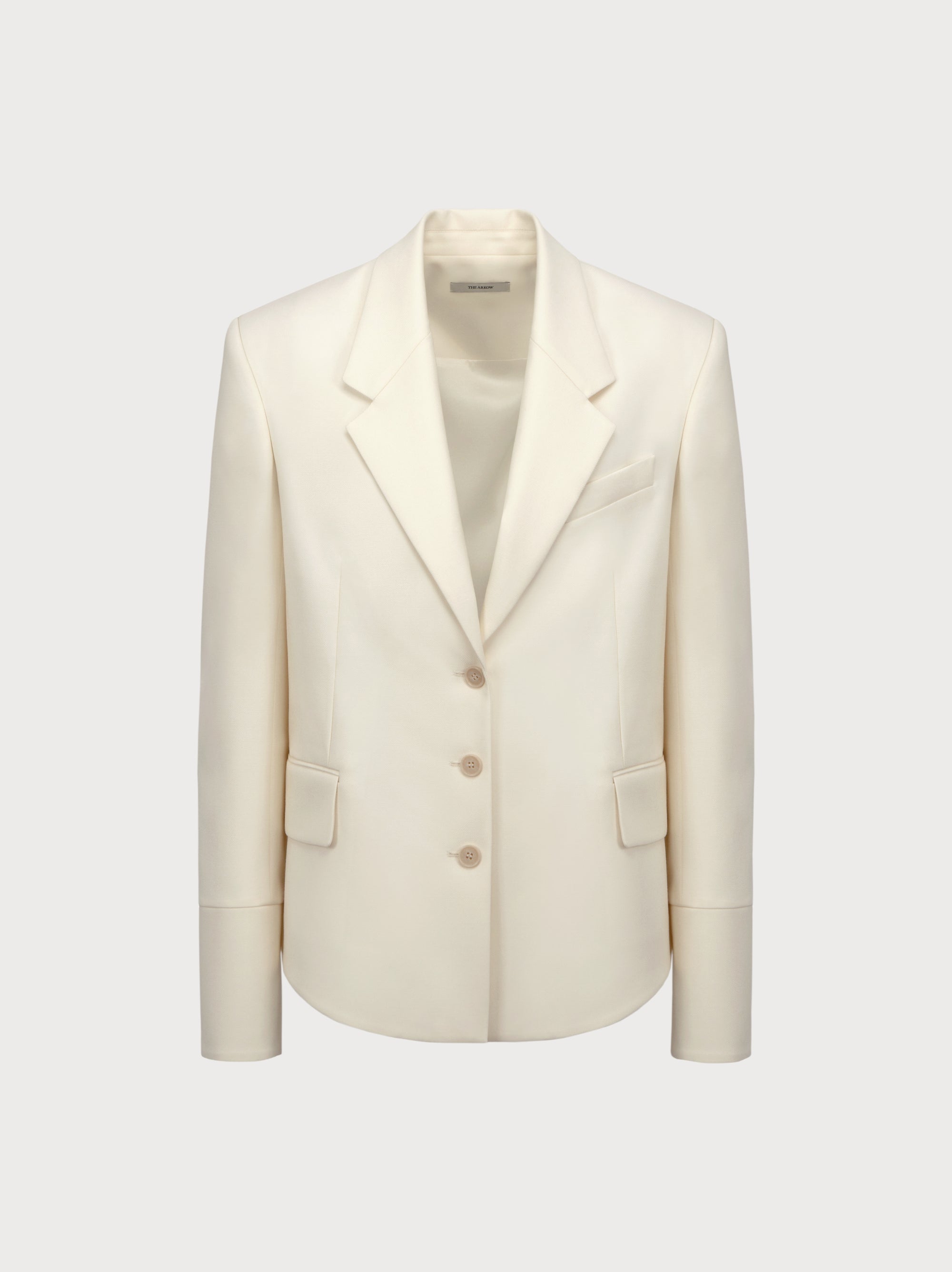 White blazer on a light gray background