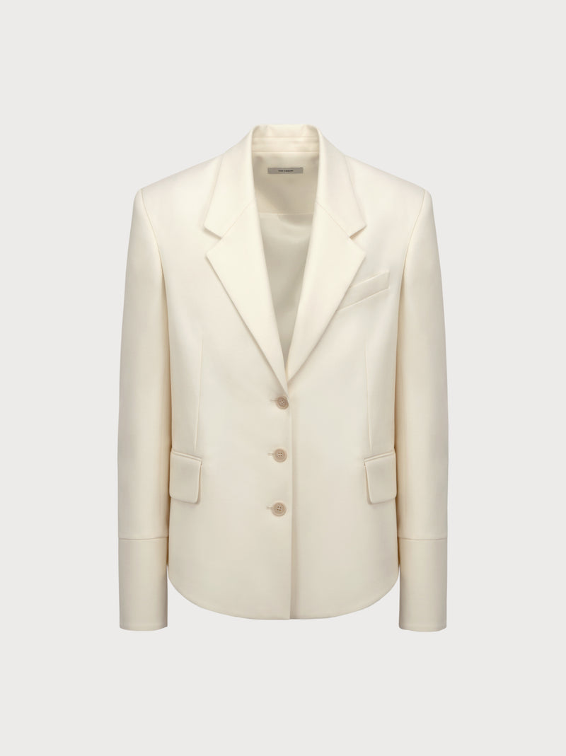 White blazer on a light gray background