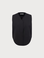 Black sleeveless top on a light gray background