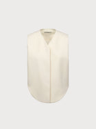 White vest with a collar on a light gray background