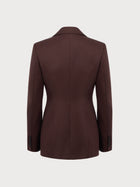 Brown blazer on a light gray background