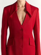 Red blazer with a plunging neckline on a white background