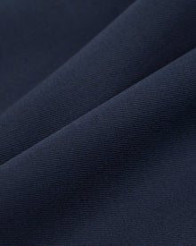 Nina Trousers in Navy Virgin Wool - fabric texture close-up