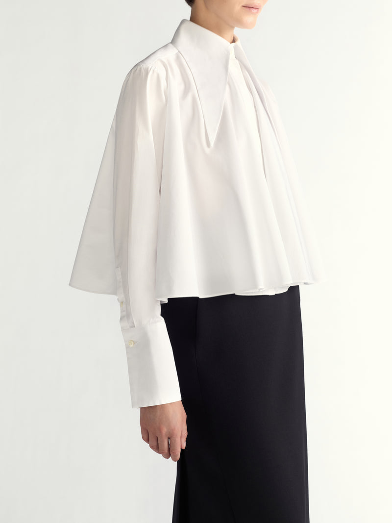 White shirt worn by a person on a white background