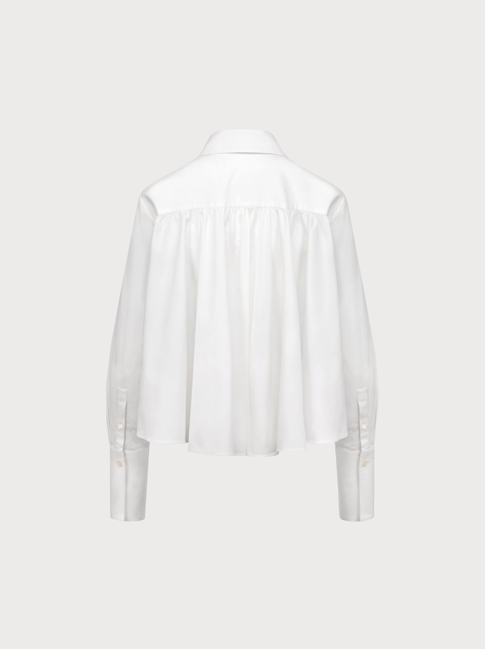 White blouse on a light gray background