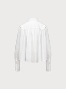 White blouse on a light gray background