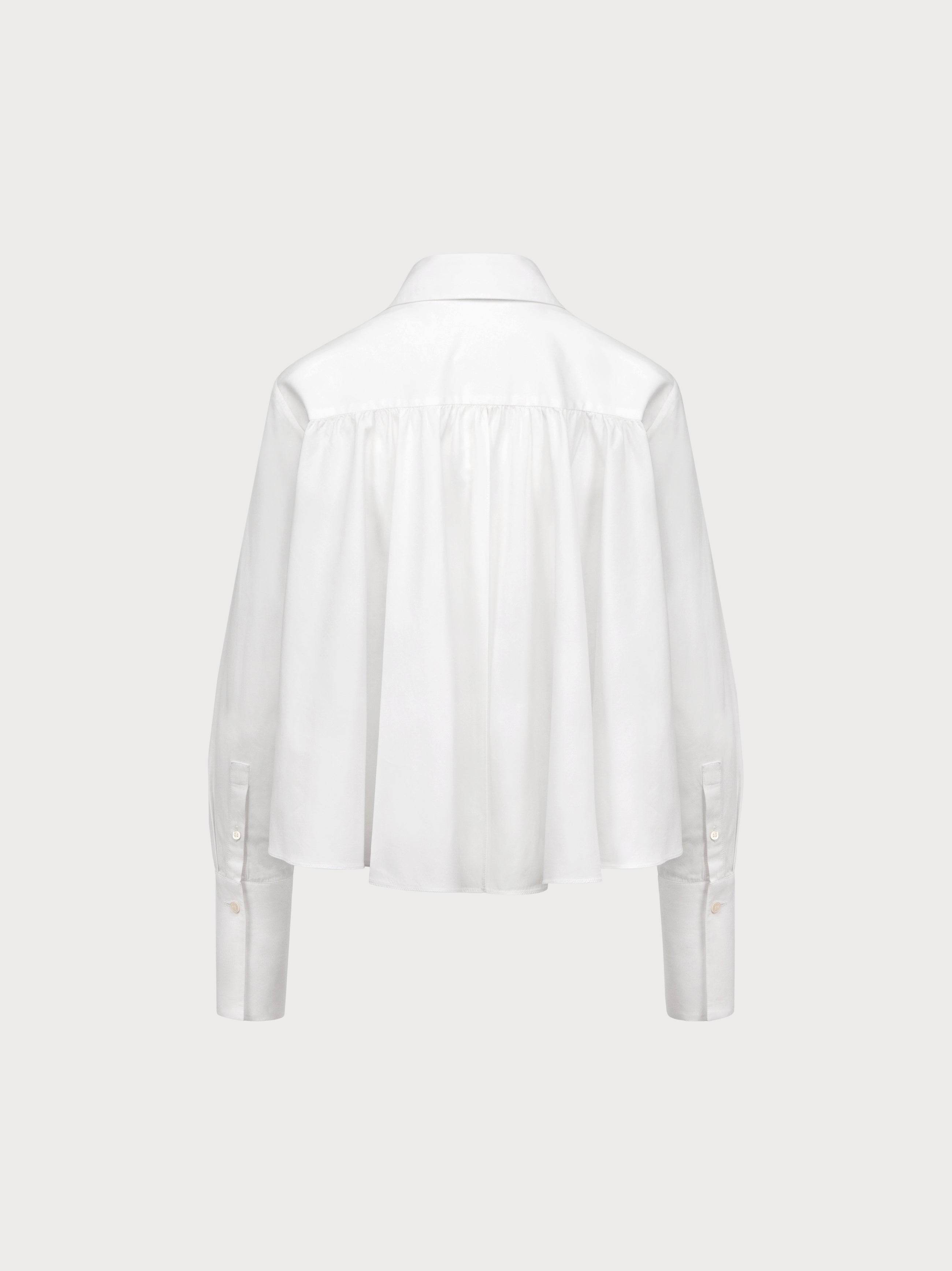 White blouse on a light gray background