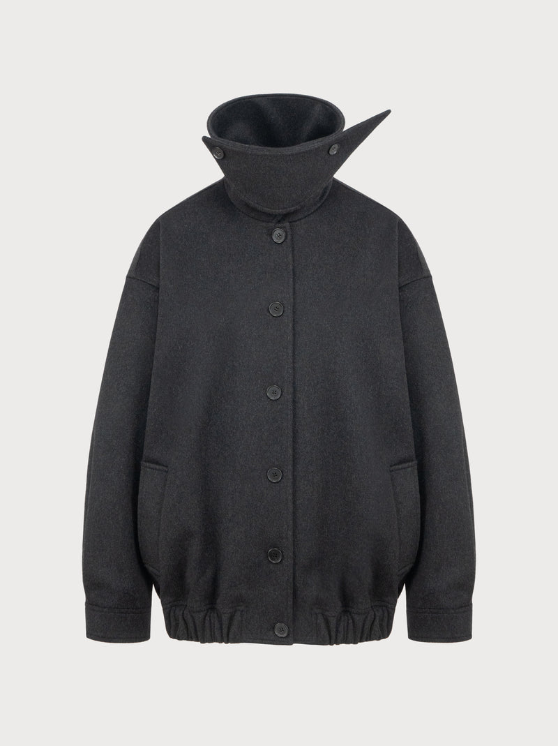 Dark gray jacket with a high collar on a light gray background