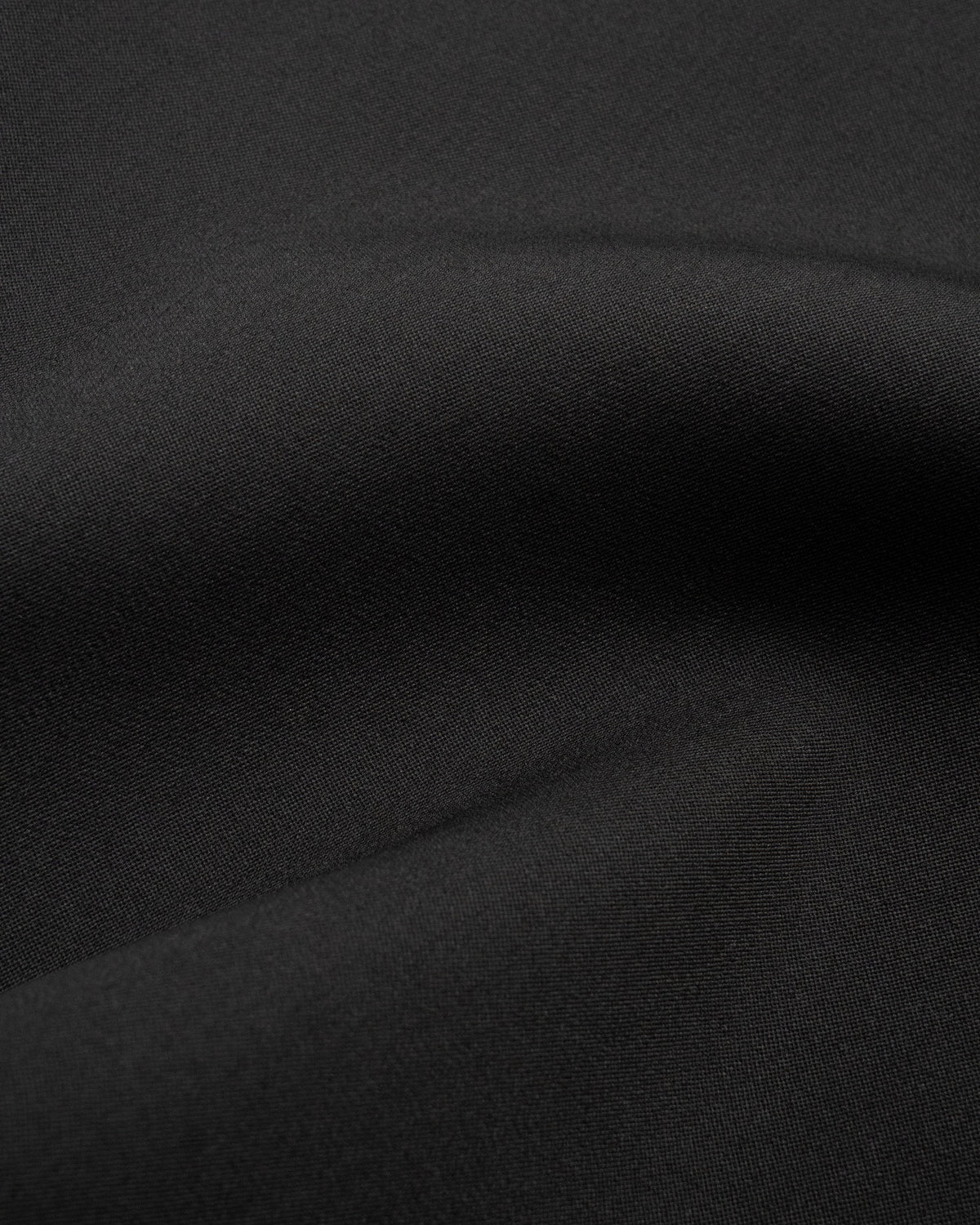 Talia Dress in Black Virgin Wool - fabric texture close-up