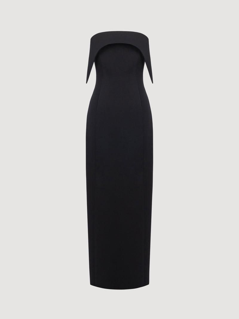 Black dress with a unique neckline on a light gray background