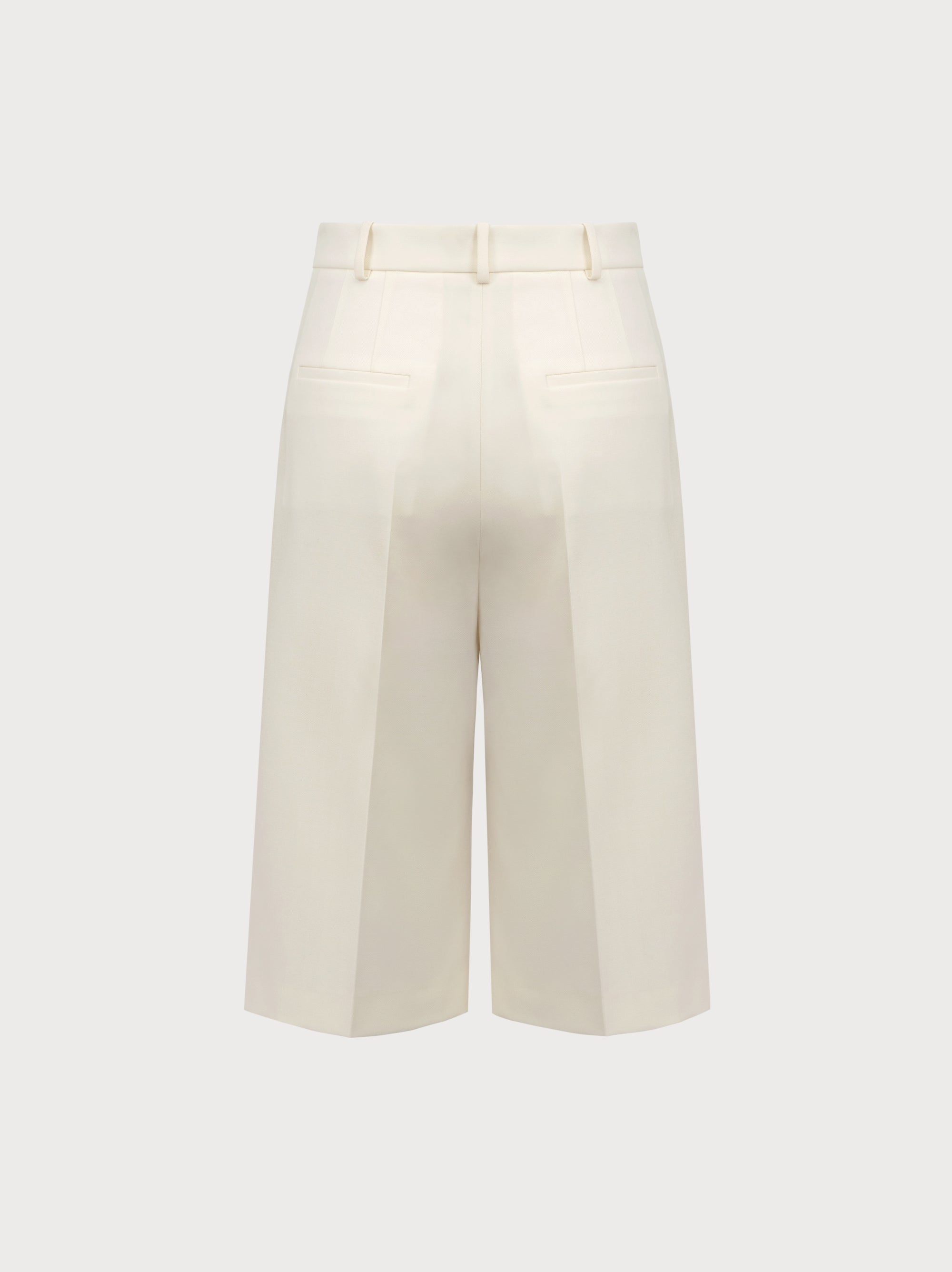 White wide-leg pants on a light gray background