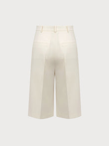 White wide-leg pants on a light gray background