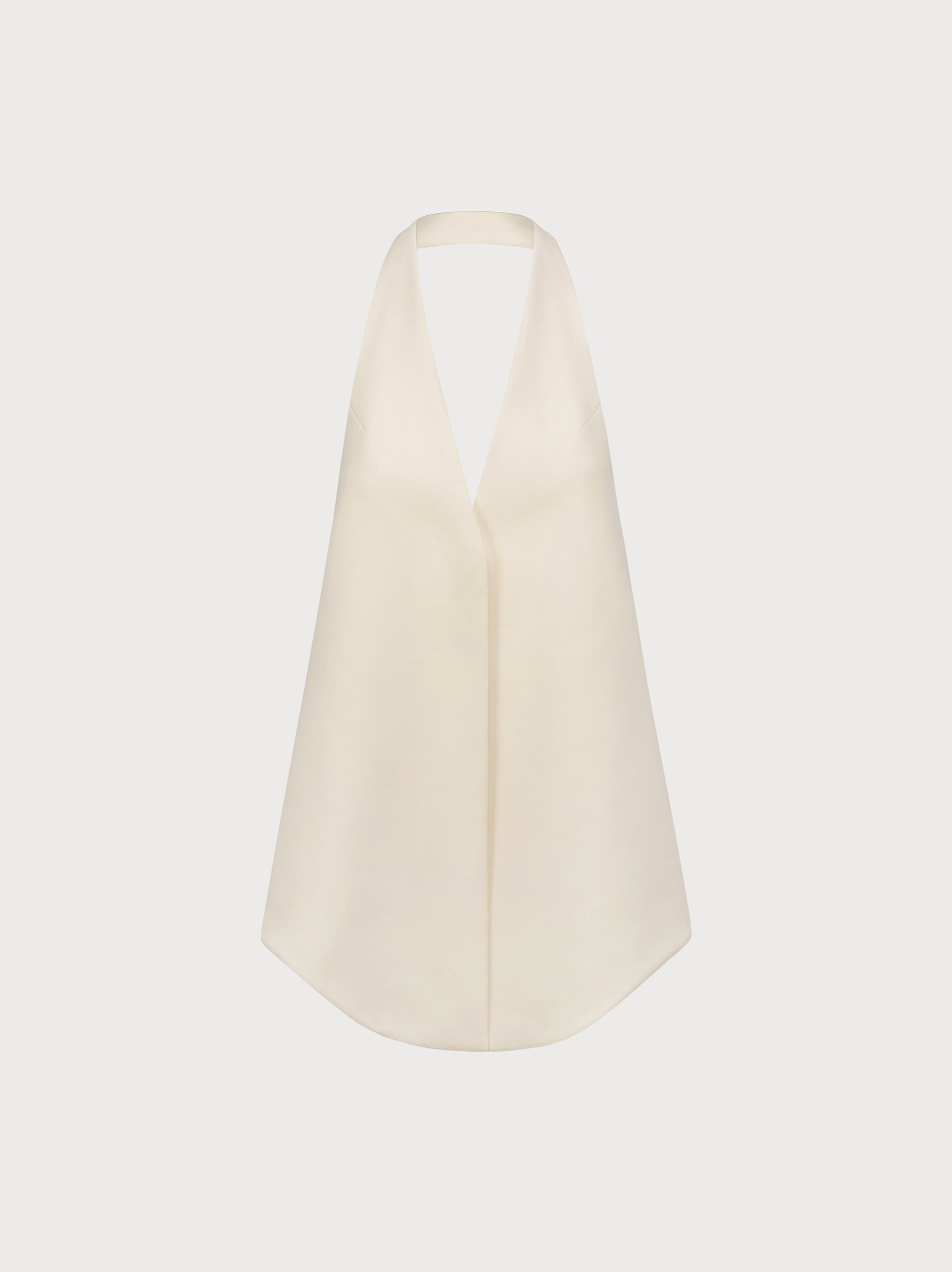 Beige halter top on a light beige background